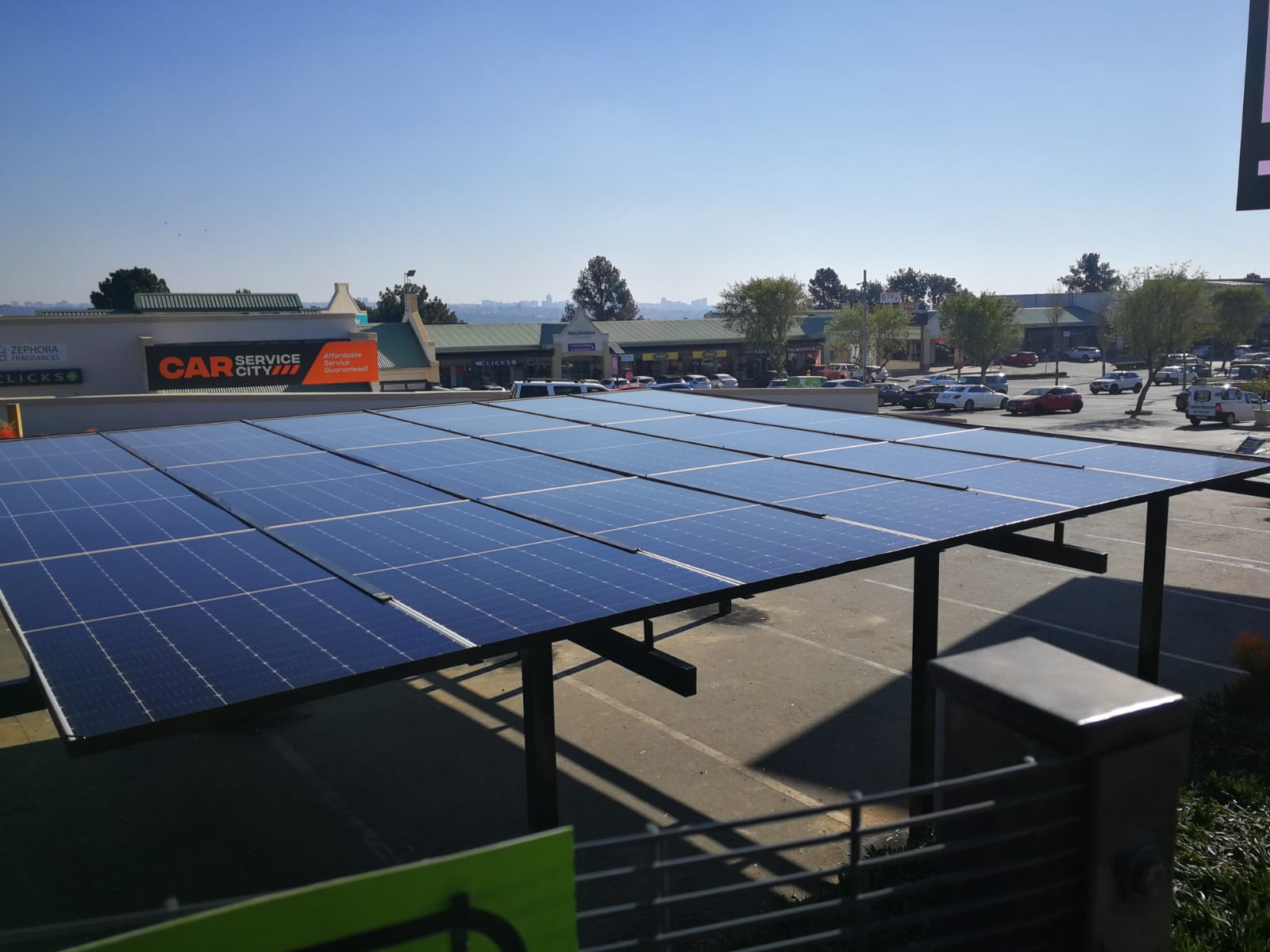 Solar canopy installed over a retail parking area